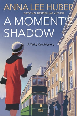 Paperback novel "A Moment's Shadow" by Kensington Publishing Corporation with a dark, shadowy cover illustration.